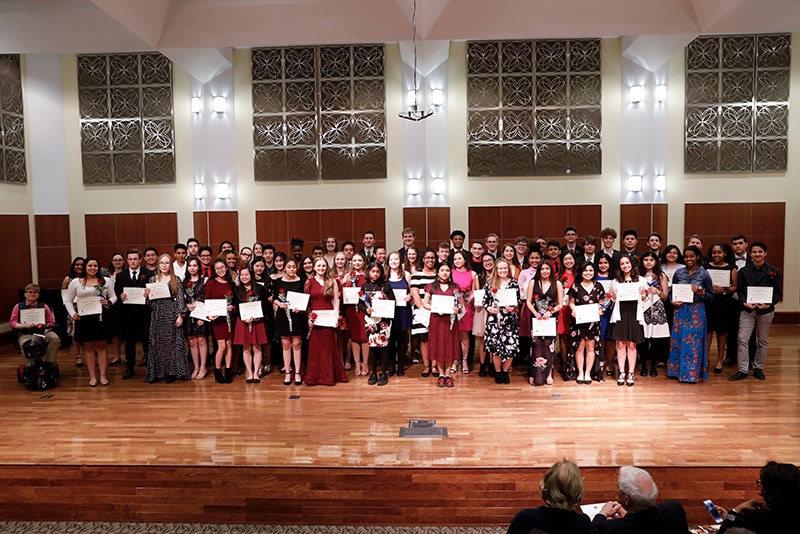 A group photo of merit conservatory students at graduation