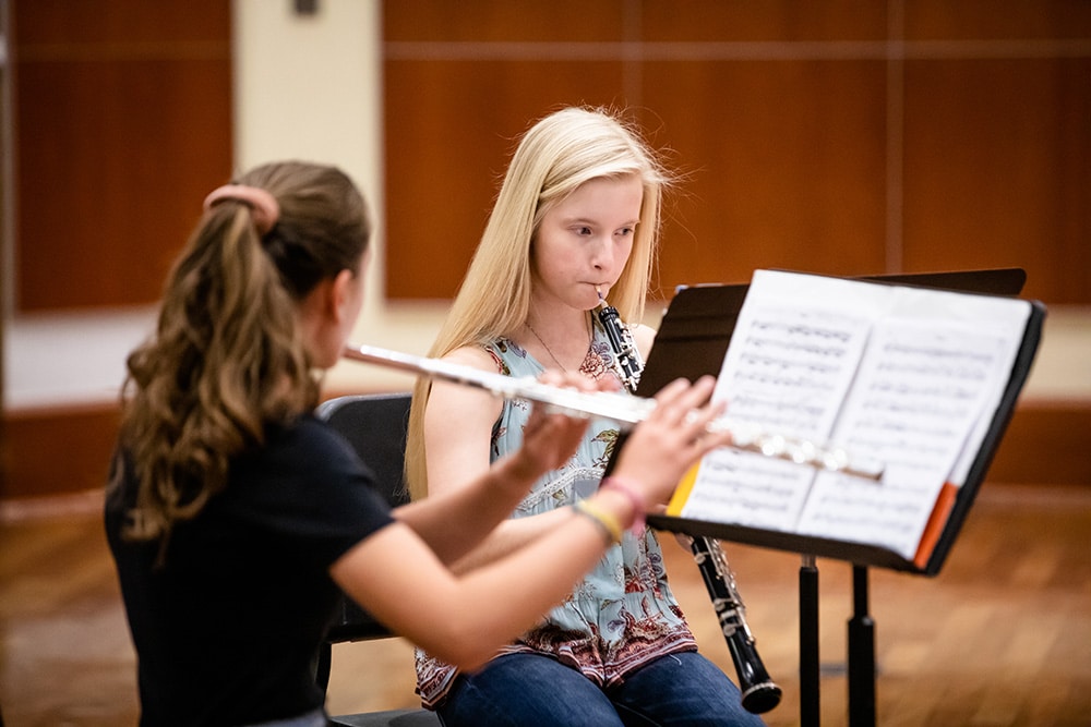 A flute and oboe player practicing their music