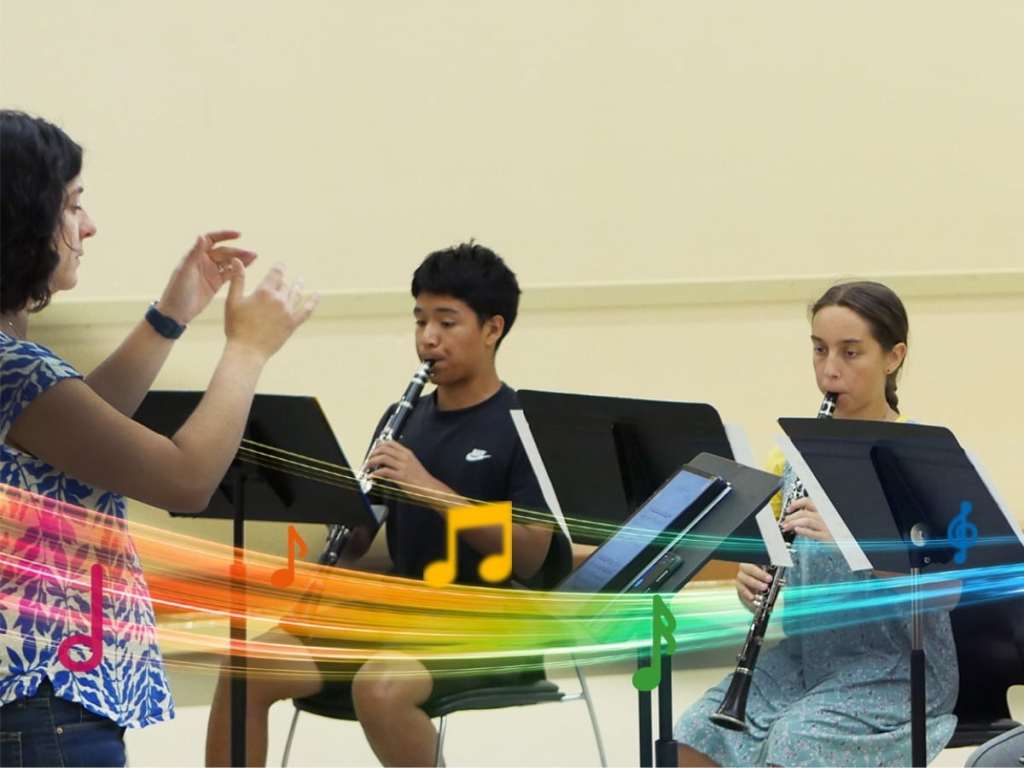 A teacher conducts as two students play clarinet