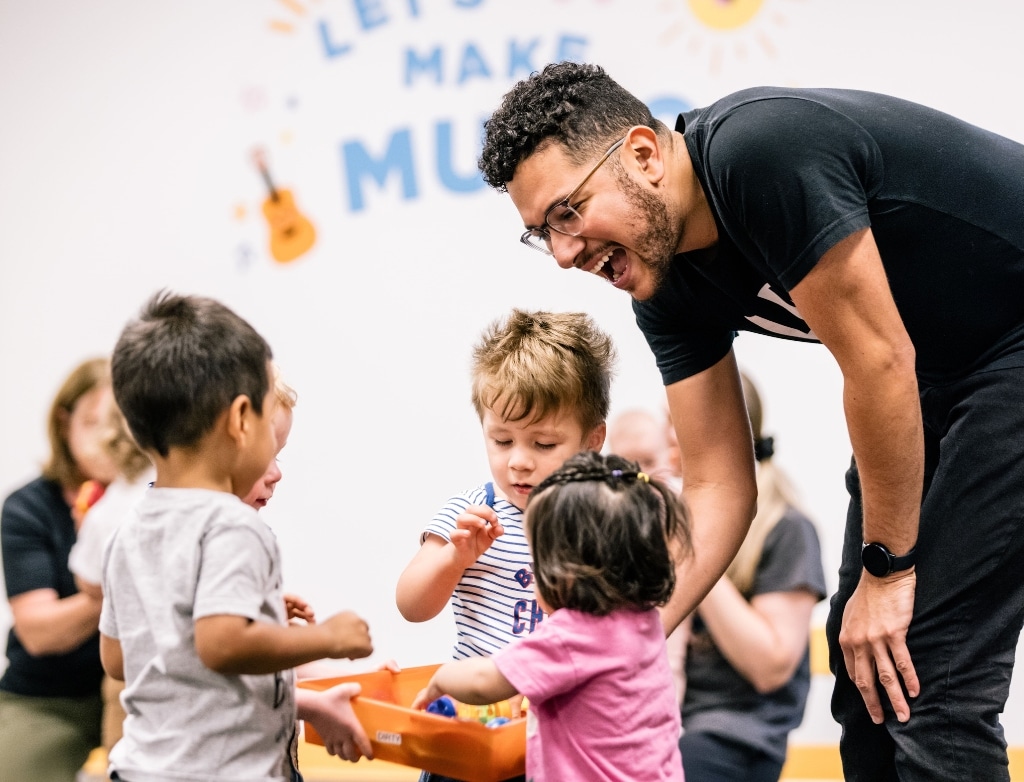 Early Childhood music class students at Merit with instructor Miro Hernandez