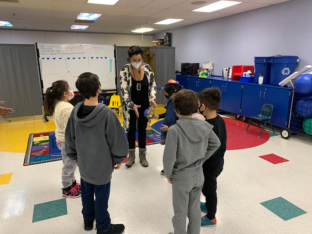 A Merit instructor working with students in a deaf or hard of hearing class