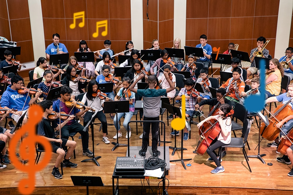 Large student ensemble performing with student conductor