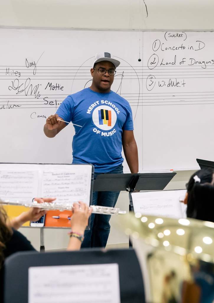 A merit instructor conducting a band ensemble class