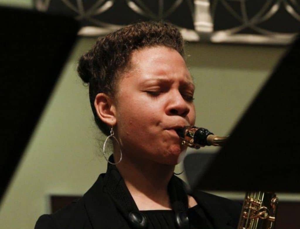 Kamila playing the saxaphone.