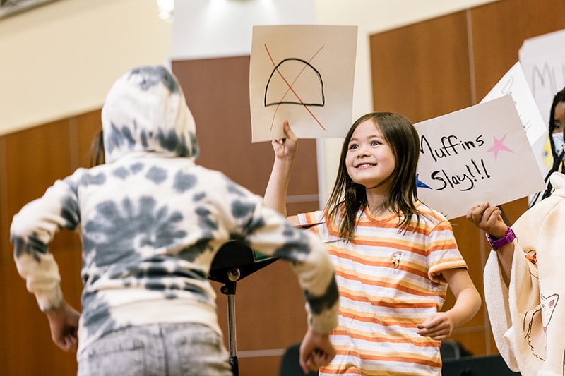 young students in a summer camp class during an activity
