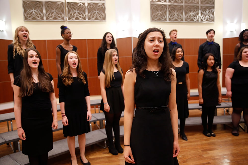 Choir students singing during an ensemble performance