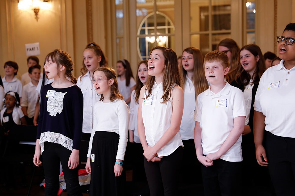 Merit fest choir singing during a live performance