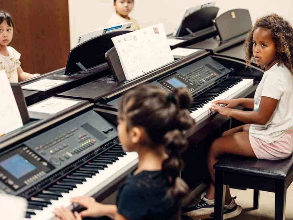 Small group piano classes at Merit