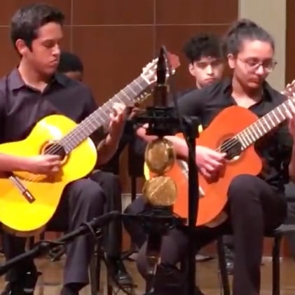 Merit's guitar ensemble performs diablo rojo