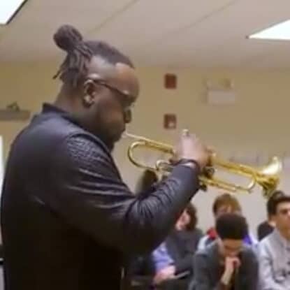 Alumni marquis hill playing a trumpet