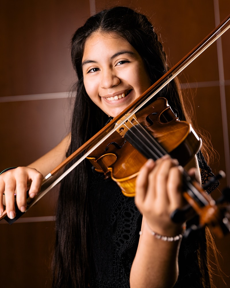 A student violin player during practice