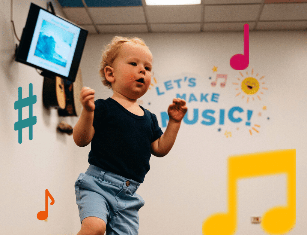 A young child dances in the Early Childhood classroom, surrounded by colorful music notes.