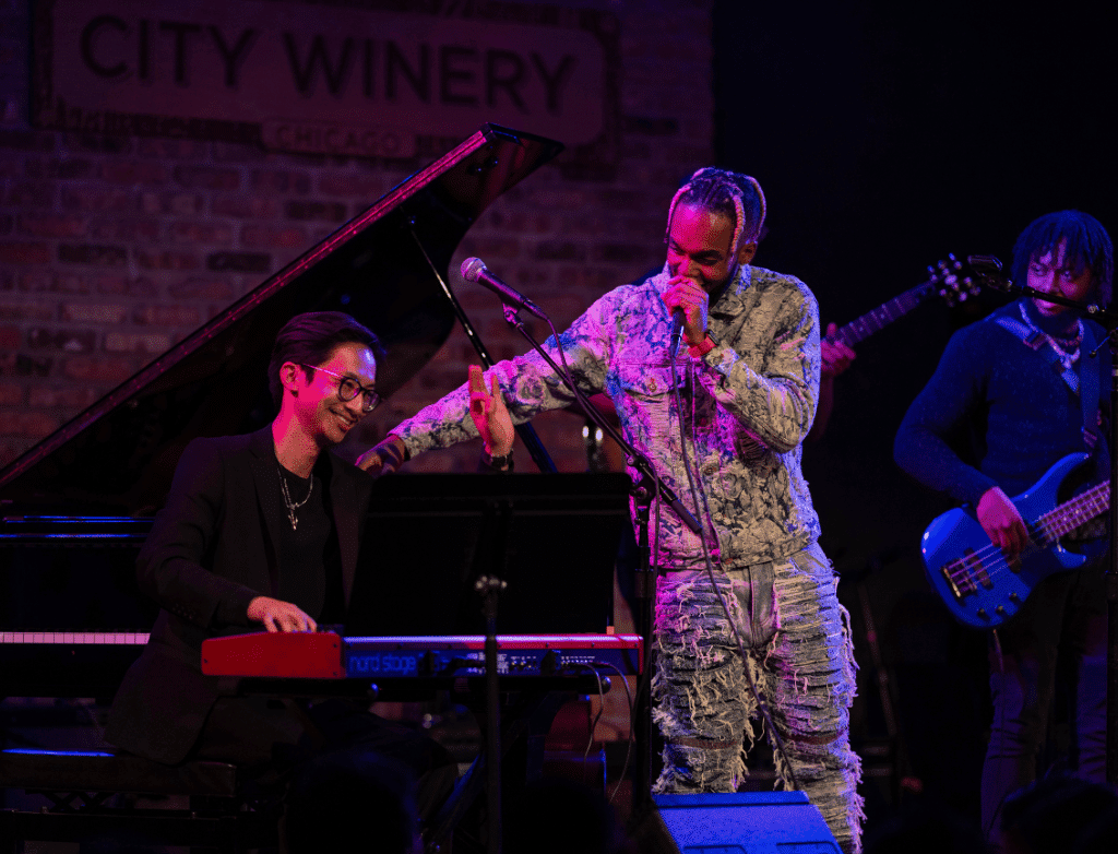 King Melik claps his pianist on the back during his performance.