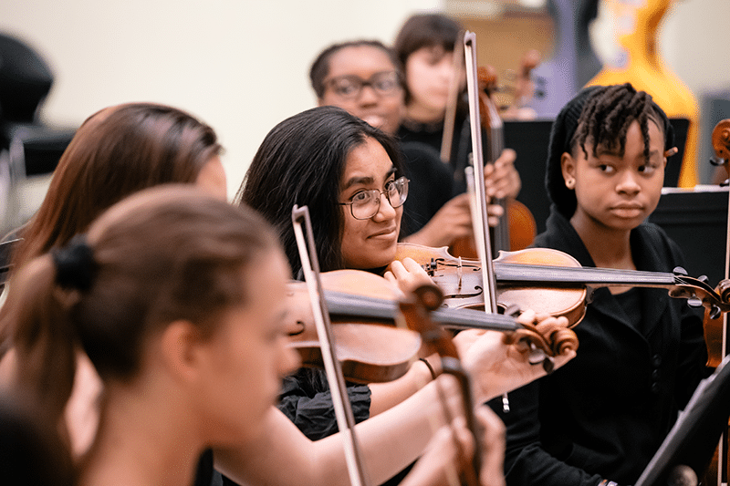 A string ensemble during a rehearsal